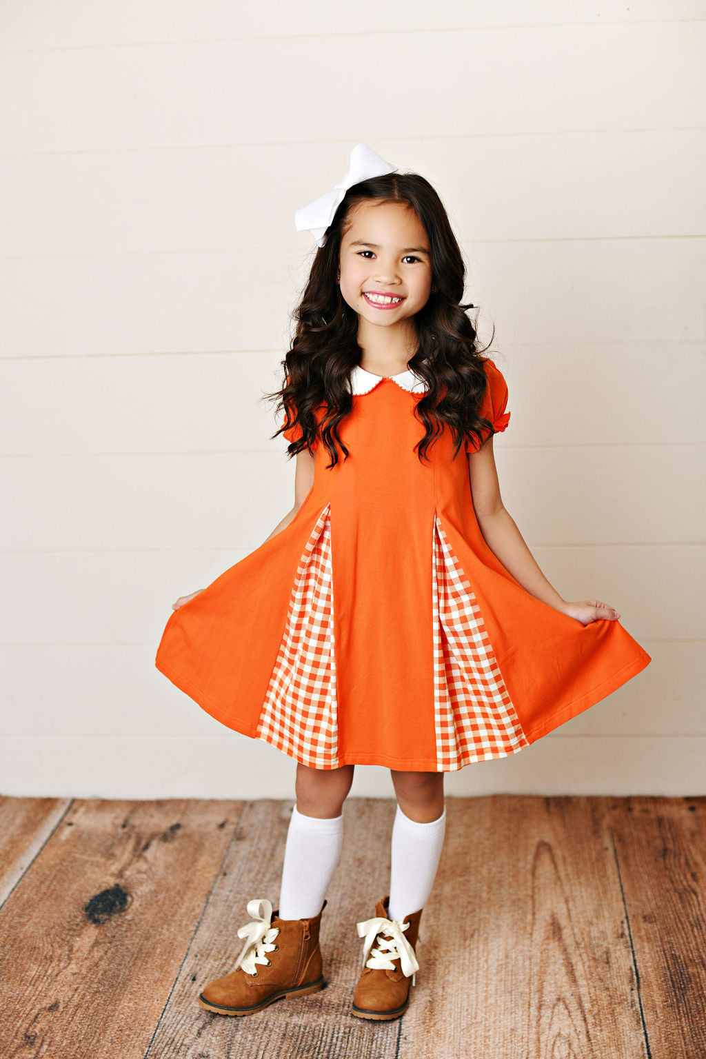 Orange gingham pleat dress